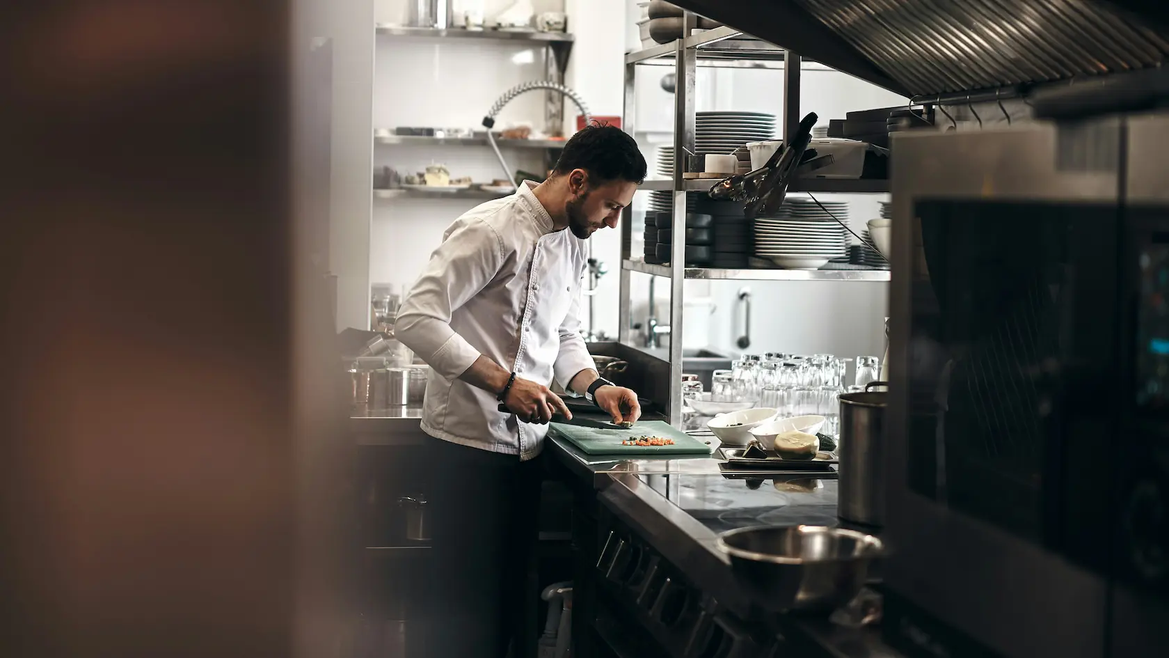 Chef working in a fitted commercial kitchen